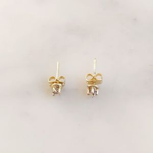 NWT. Diamond International Gold Tone with Small Diamond (3mm) Stud Earrings.